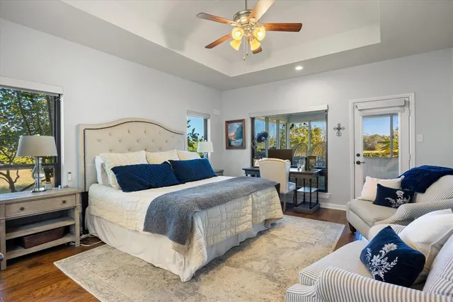 a bathroom with a glass shower door and a bathtub