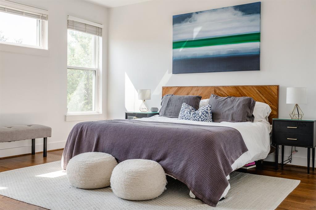 3930 Bowser Avenue, Unit 11 Dallas, TX 75219 - Photo 21 of 39 a bedroom with a bed and window