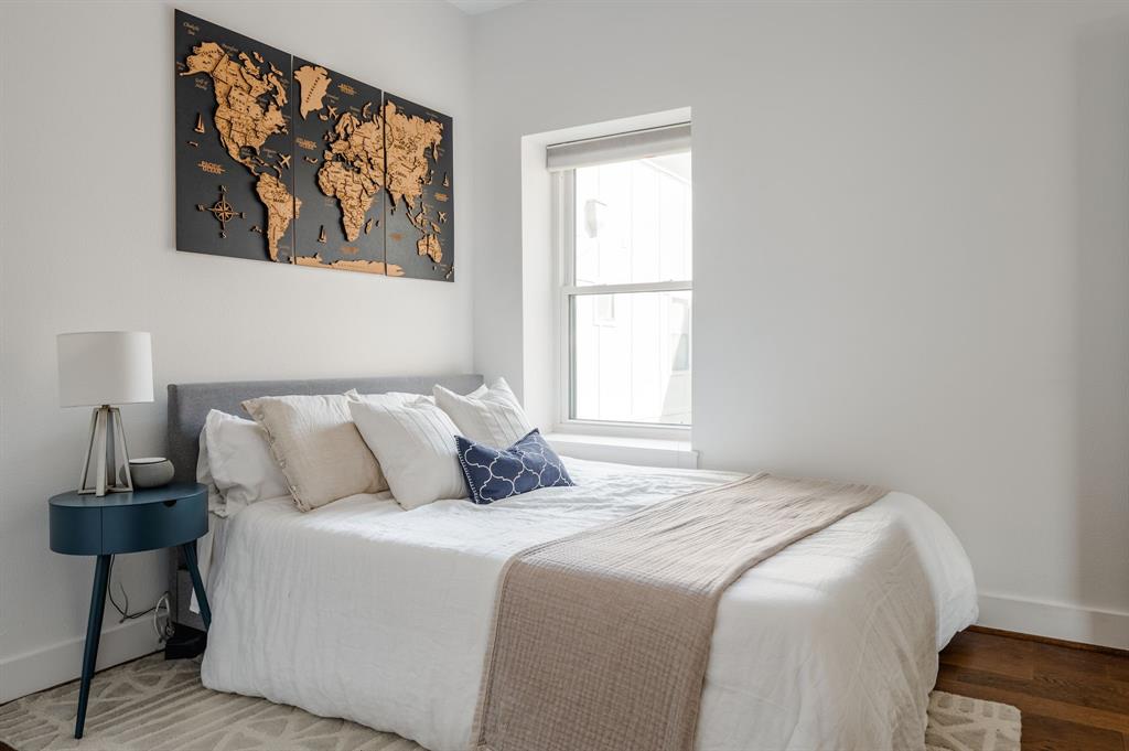 3930 Bowser Avenue, Unit 11 Dallas, TX 75219 - Photo 31 of 39 a bedroom with a bed and a window
