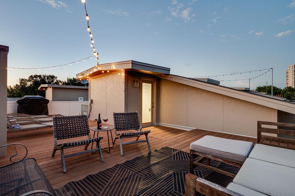 3930 Bowser Avenue, Unit 11 Dallas, TX 75219 - Photo 35 of 39 a backyard of a house with outdoor seating