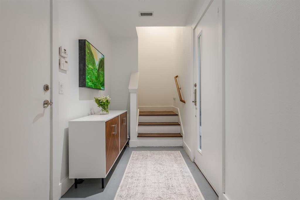 3930 Bowser Avenue, Unit 11 Dallas, TX 75219 - Photo 4 of 39 a view of entryway with wooden floor