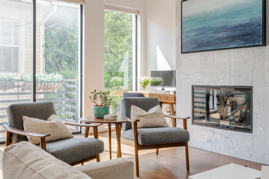 3930 Bowser Avenue, Unit 11 Dallas, TX 75219 - Photo 7 of 39 a living room with furniture and a fireplace