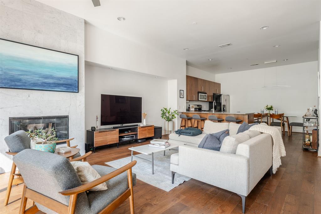 3930 Bowser Avenue, Unit 11 Dallas, TX 75219 - Photo 8 of 39 a living room with furniture and a flat screen tv