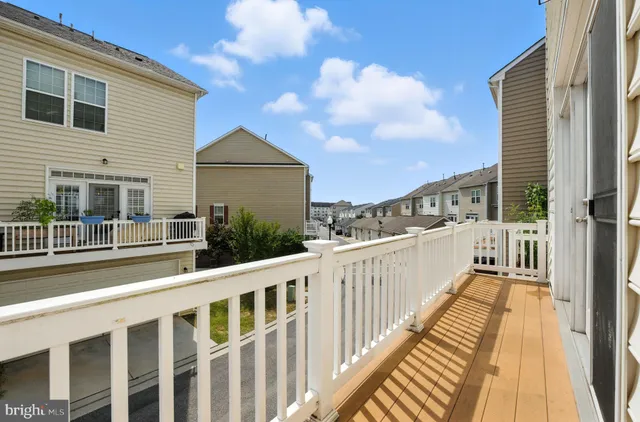 a view of a balcony with wooden floor