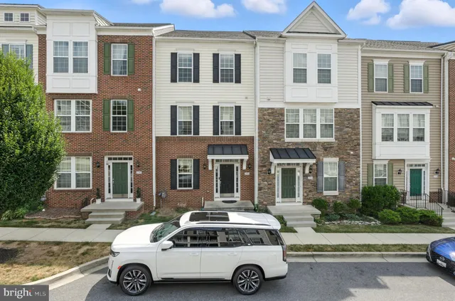 a car parked in front of a brick building