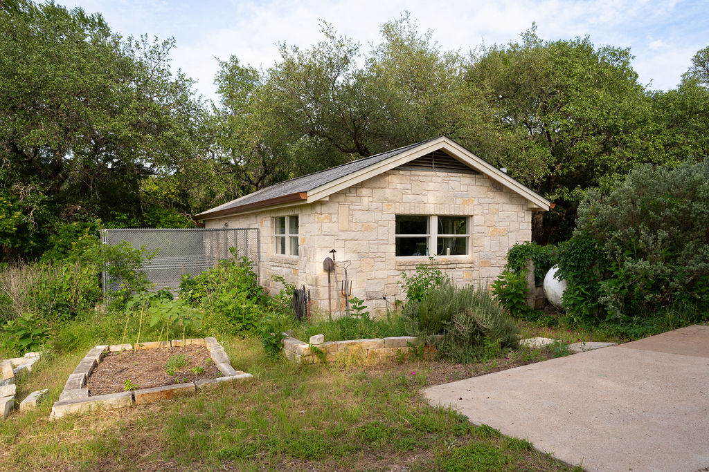 13800 Lone Rider Trail Austin, TX 78738 - Photo 18 of 27 a view of a backyard with plants and trees
