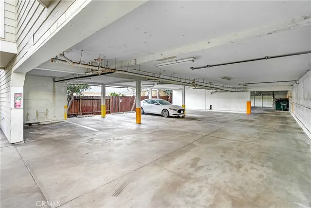 a view of parking garage with cars