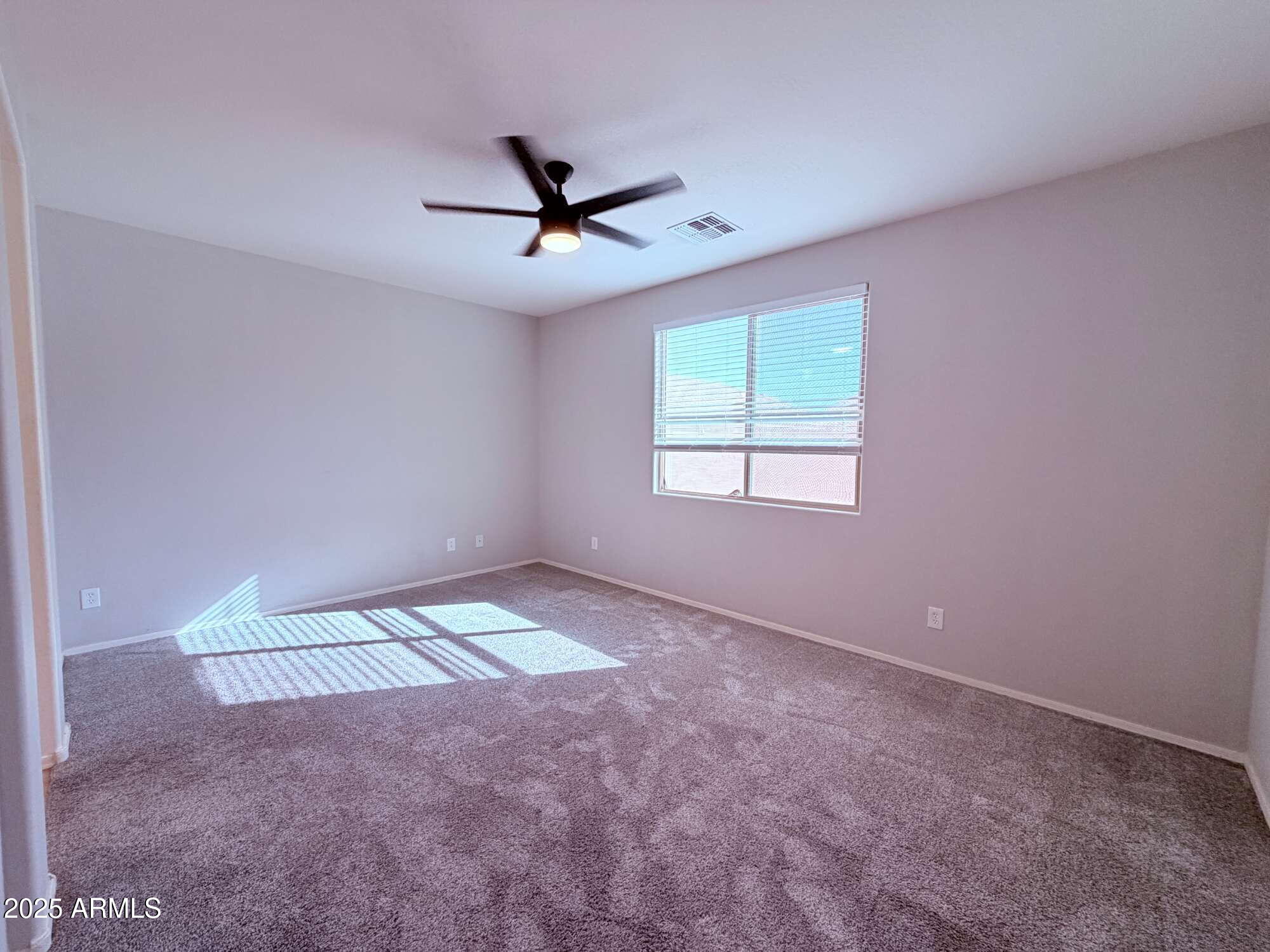 21121 East Via De Olivos Queen Creek, AZ 85142 - Photo 11 of 34 a view of an empty room with a window
