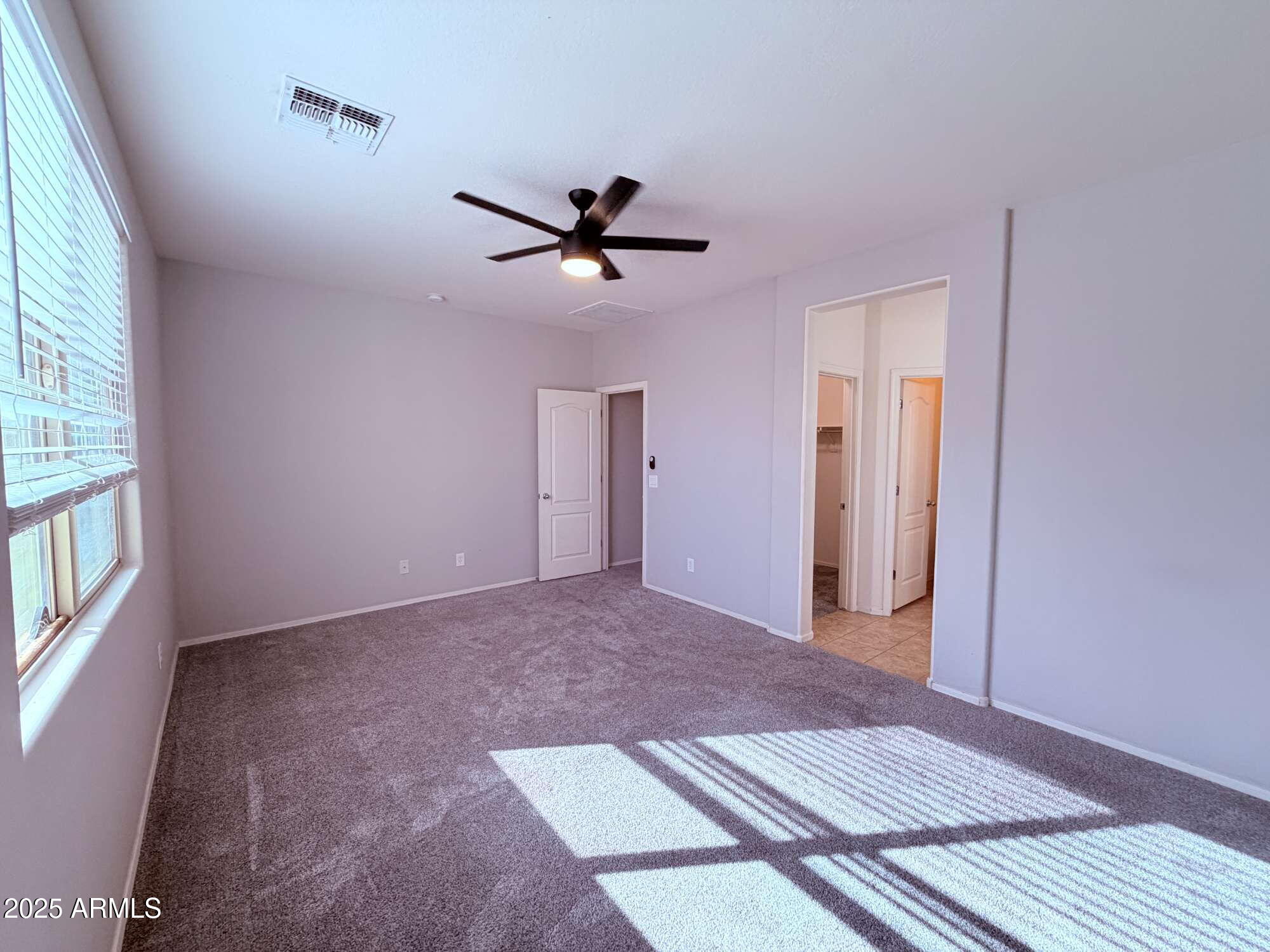 21121 East Via De Olivos Queen Creek, AZ 85142 - Photo 12 of 34 a view of an empty room with a window