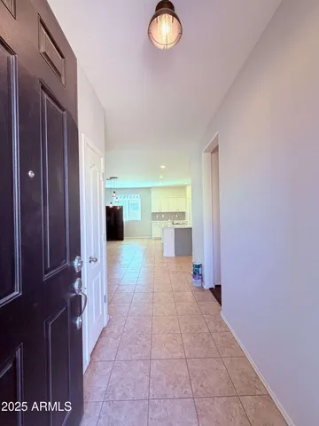 a view of a hallway with a wooden floor