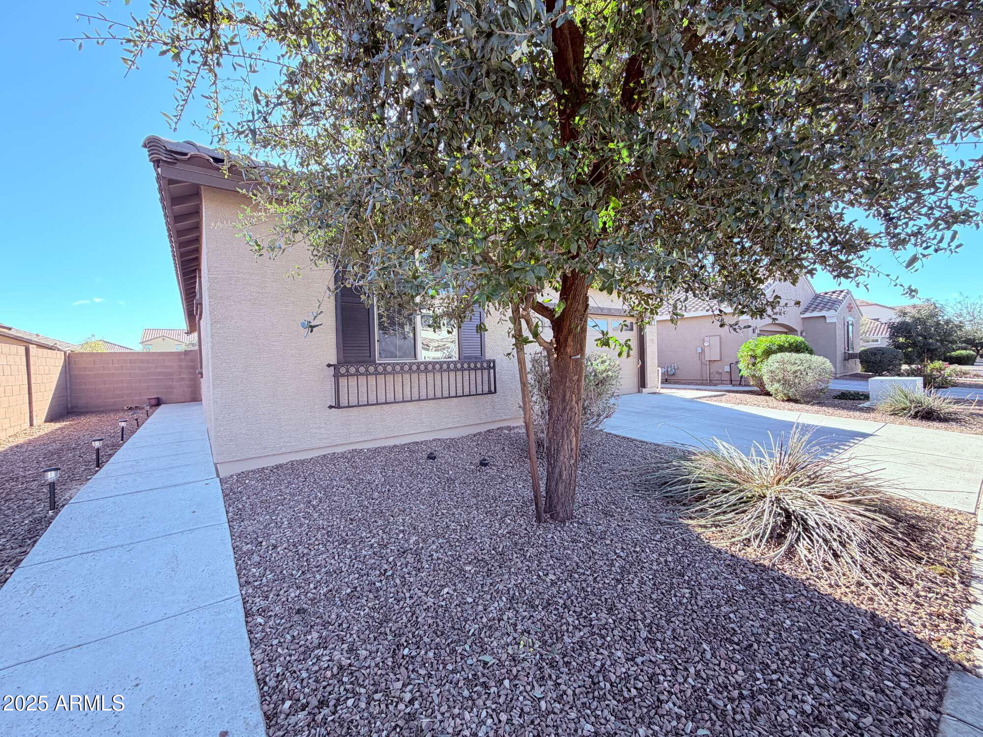 21121 East Via De Olivos Queen Creek, AZ 85142 - Photo 2 of 34 a house with trees in front of it