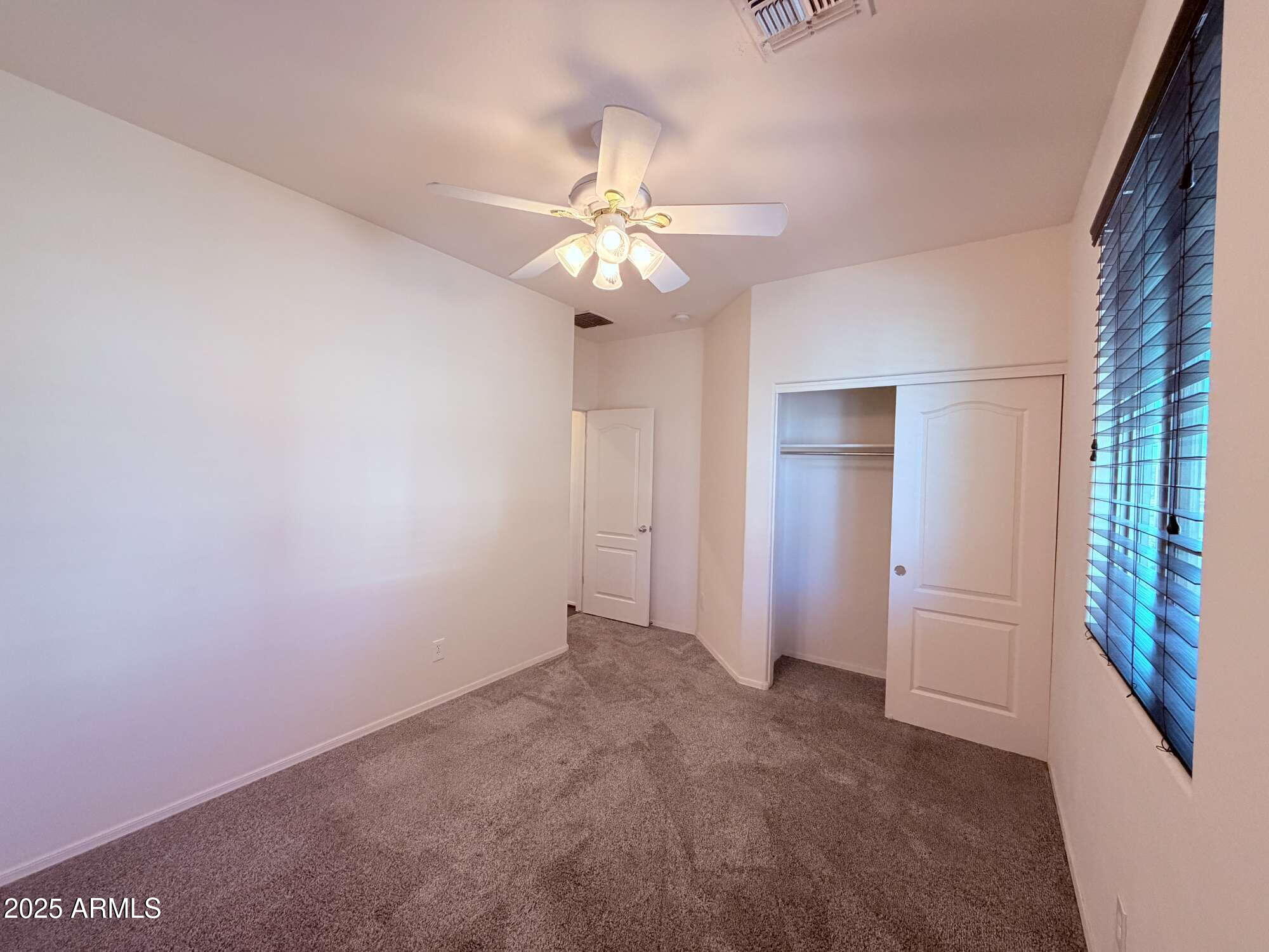 21121 East Via De Olivos Queen Creek, AZ 85142 - Photo 26 of 34 a view of an empty room with a window