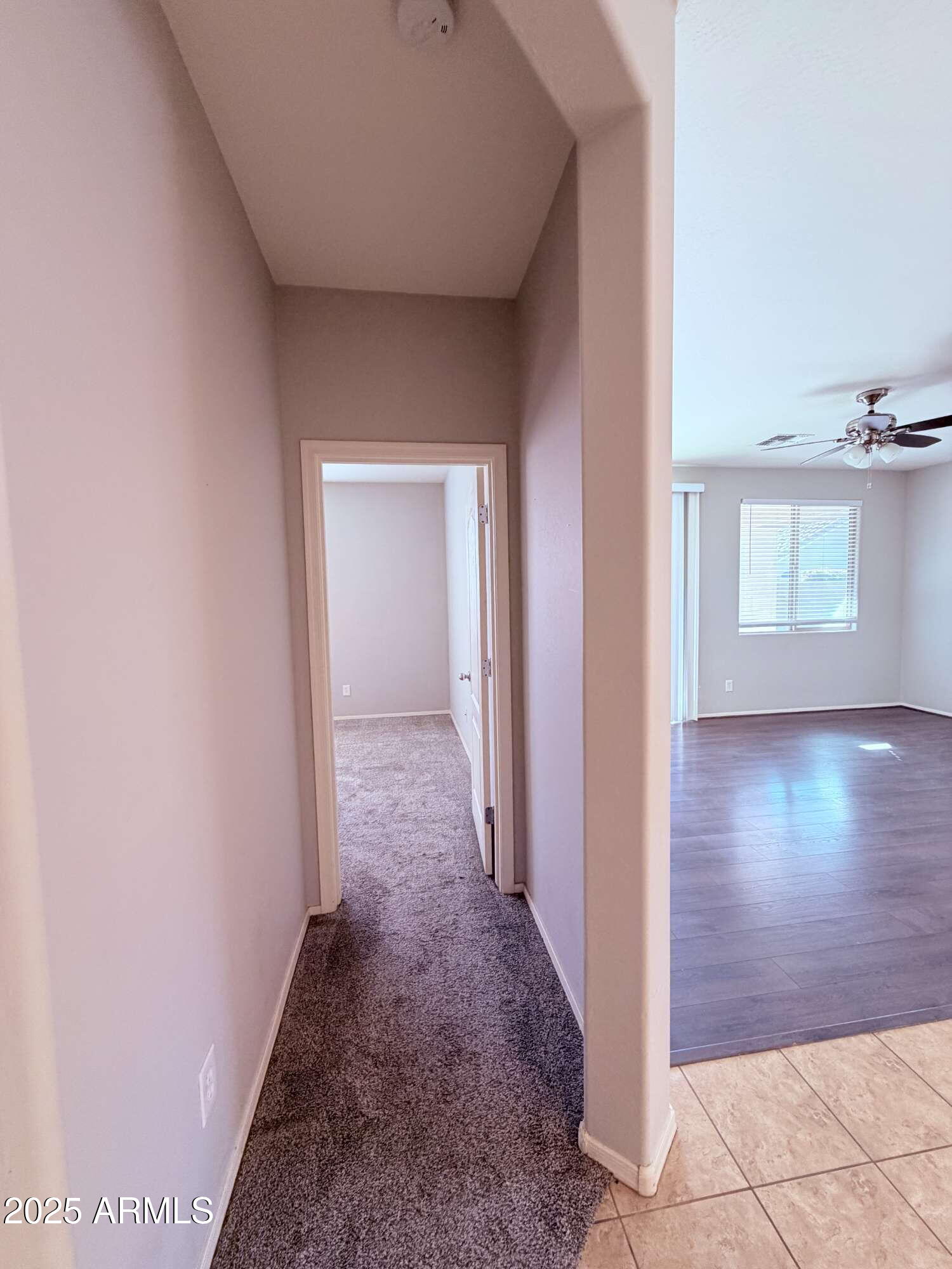 21121 East Via De Olivos Queen Creek, AZ 85142 - Photo 10 of 34 a view of a hallway with wooden floor