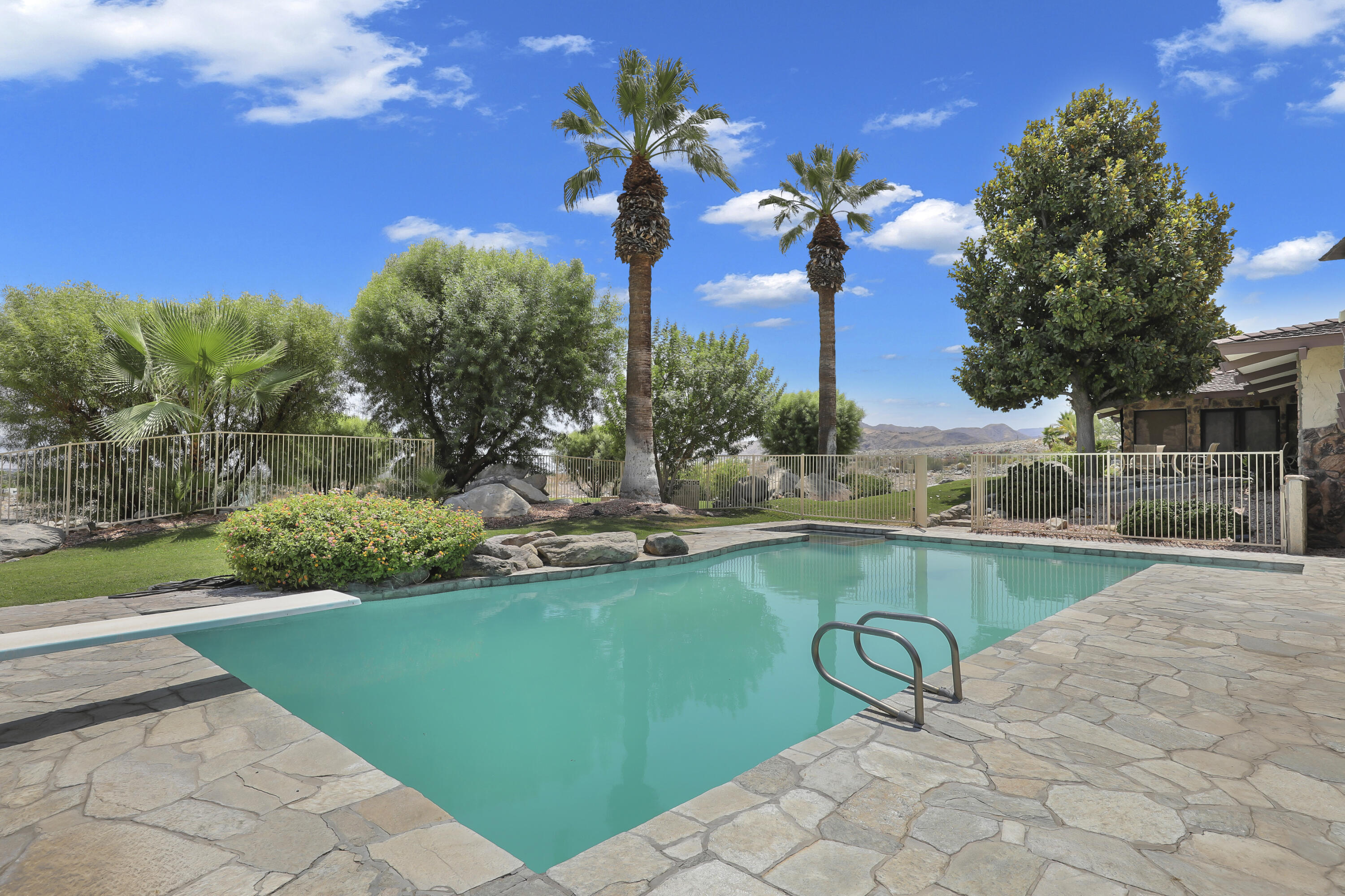 770 South La Mirada Road Palm Springs, CA 92264 - Photo 27 of 39 a view of a swimming pool and lounge chairs