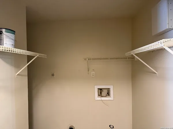 a view of a blue wall with a window