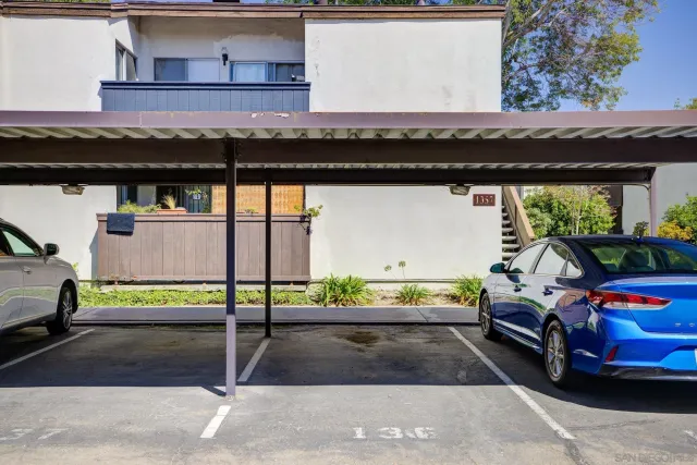 a view of a patio with table and chairs