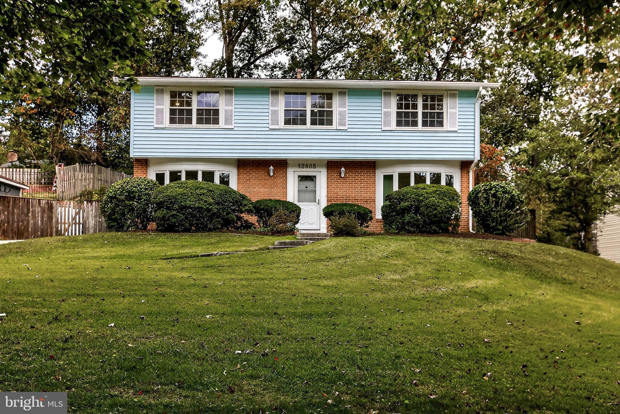 12805 Broadmore Road Silver Spring, MD 20904 - Photo 2 of 48 a front view of a house with garden