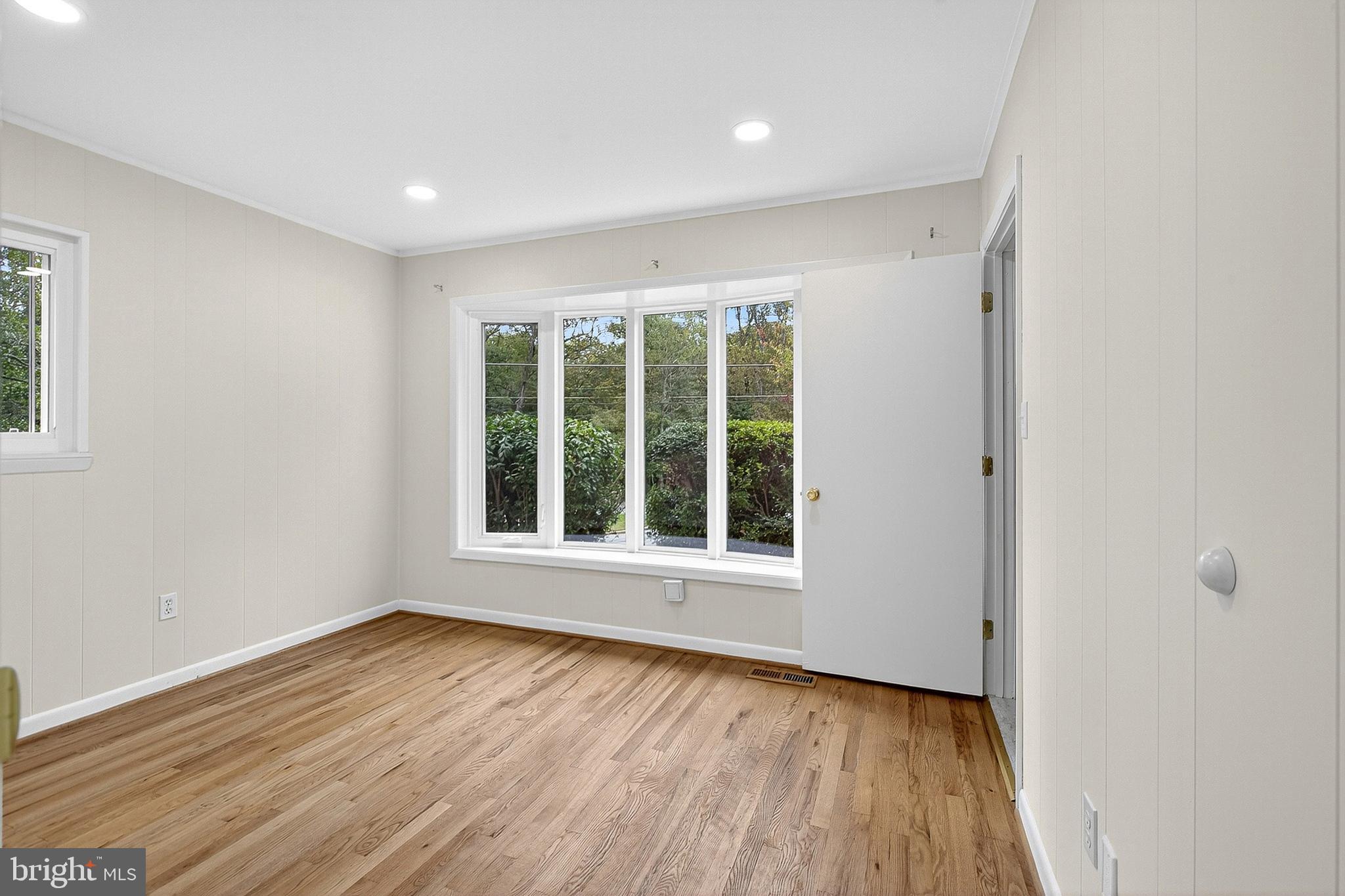 12805 Broadmore Road Silver Spring, MD 20904 - Photo 8 of 48 an empty room with wooden floor and windows