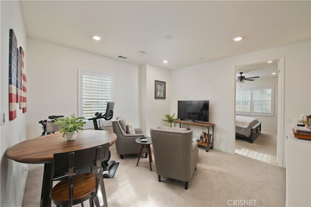 22880 Concord Drive Saugus, CA 91350 - Photo 14 of 34 a view of a dining room with furniture and a flat screen tv