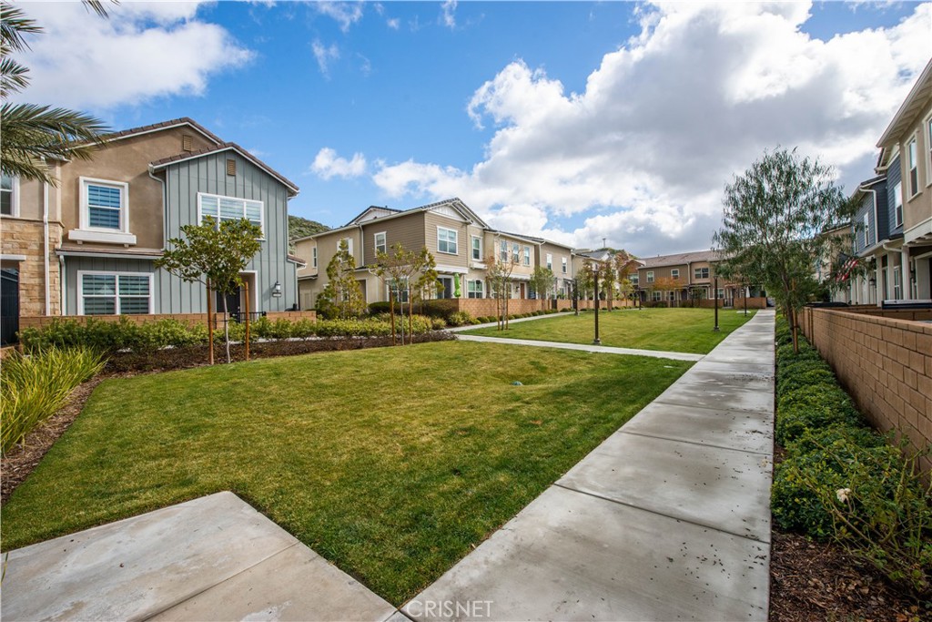 22880 Concord Drive Saugus, CA 91350 - Photo 30 of 34 a view of a big house with a big yard and potted plants