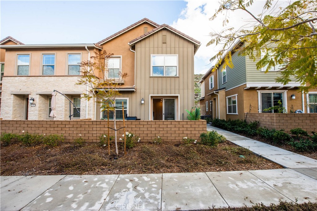 22880 Concord Drive Saugus, CA 91350 - Photo 3 of 34 a front view of a house with a yard