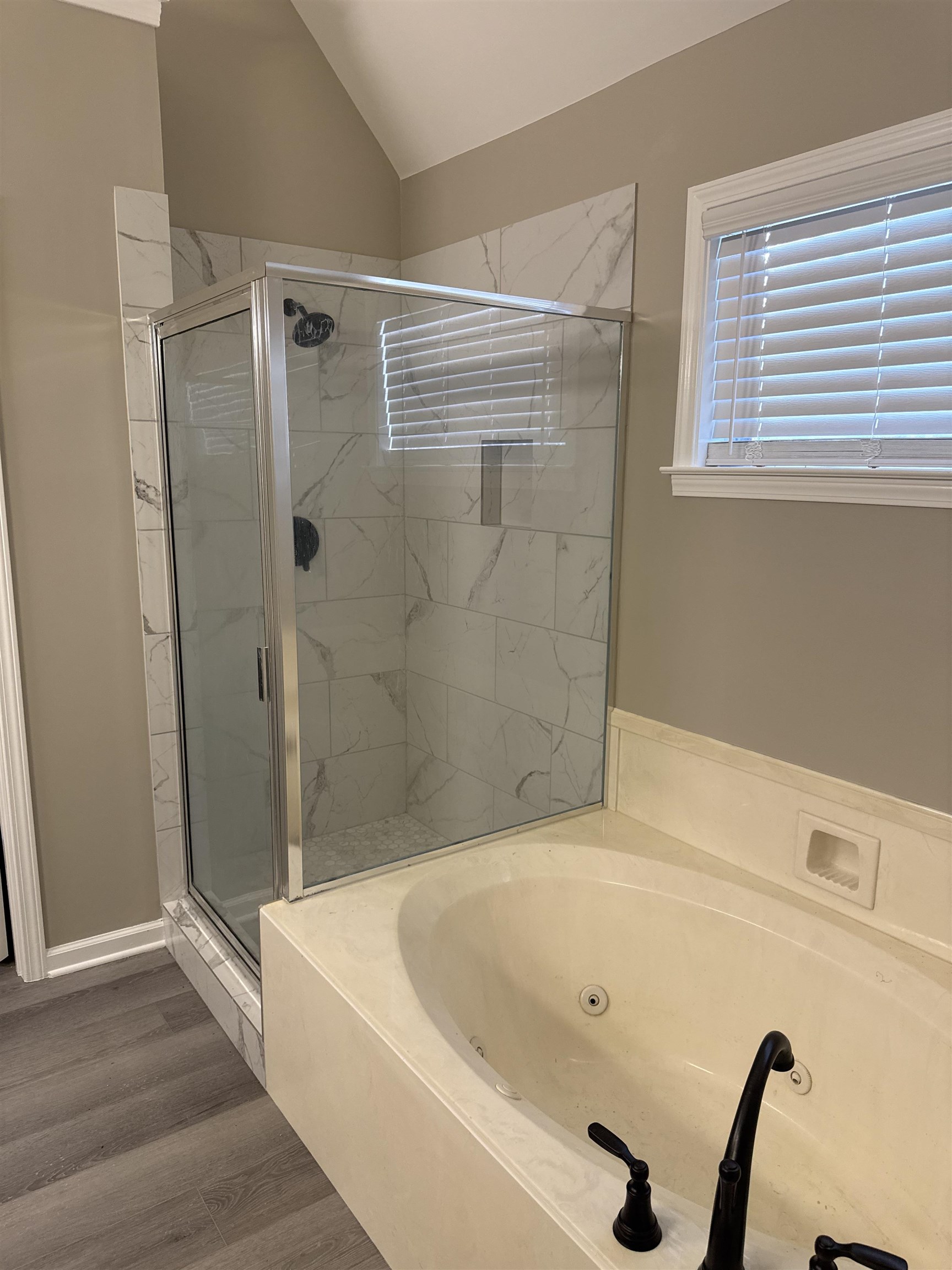 6333 Daybreak Drive Bartlett, TN 38135 - Photo 11 of 21 a bathroom with a tub and a shower