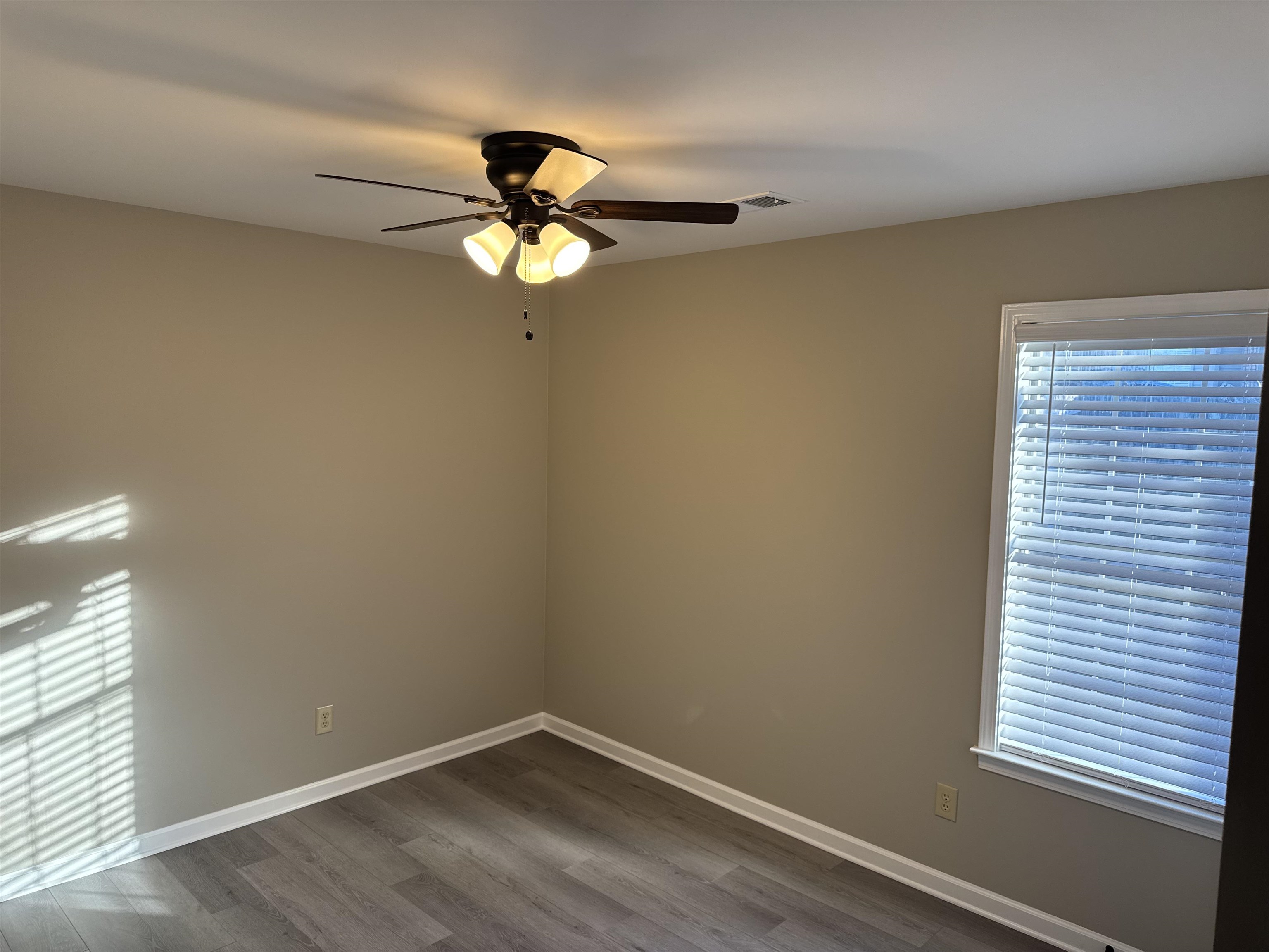 6333 Daybreak Drive Bartlett, TN 38135 - Photo 16 of 21 an empty room with a window and ceiling fan