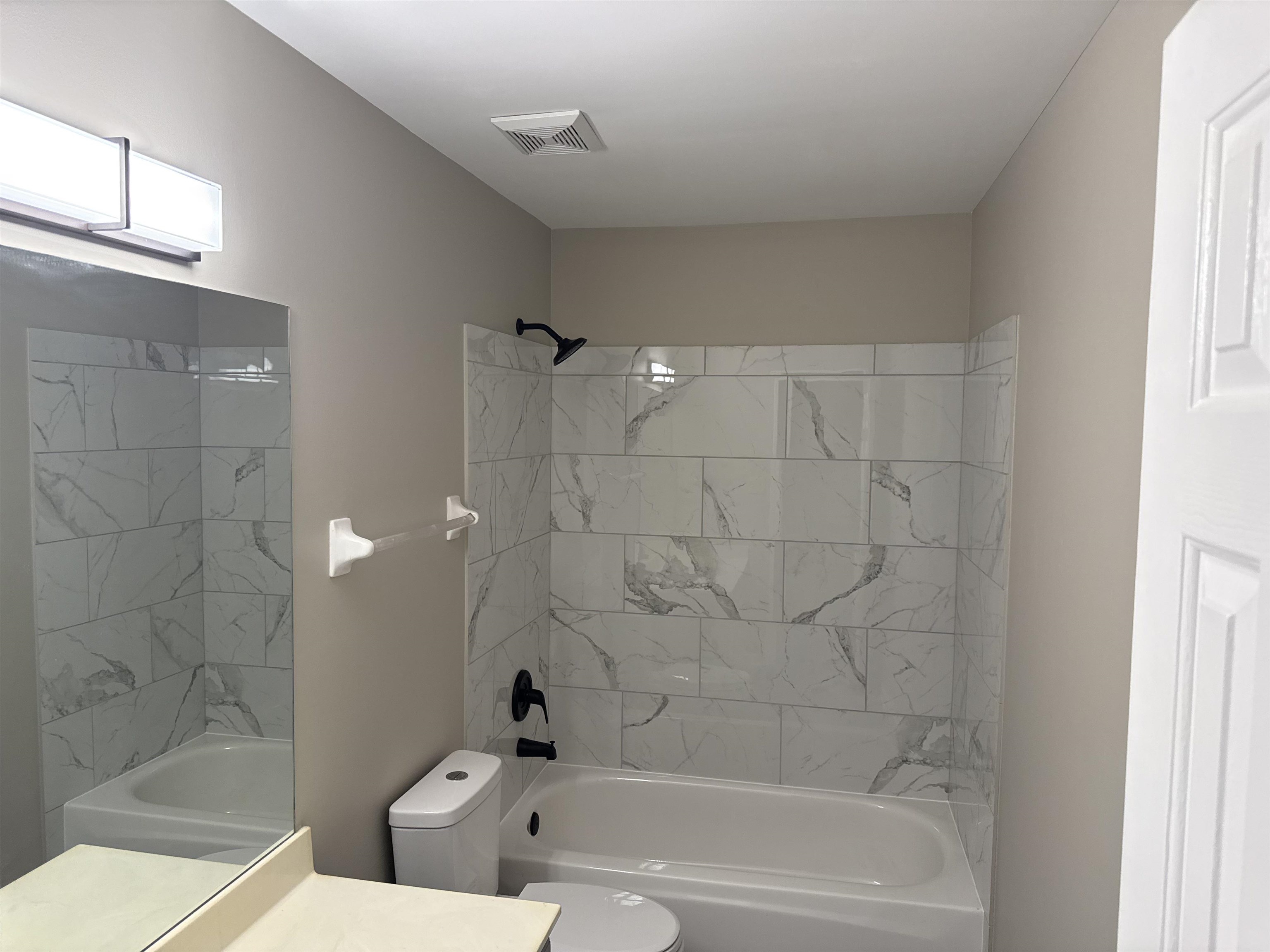 6333 Daybreak Drive Bartlett, TN 38135 - Photo 17 of 21 a bathroom with a bathtub and a shower