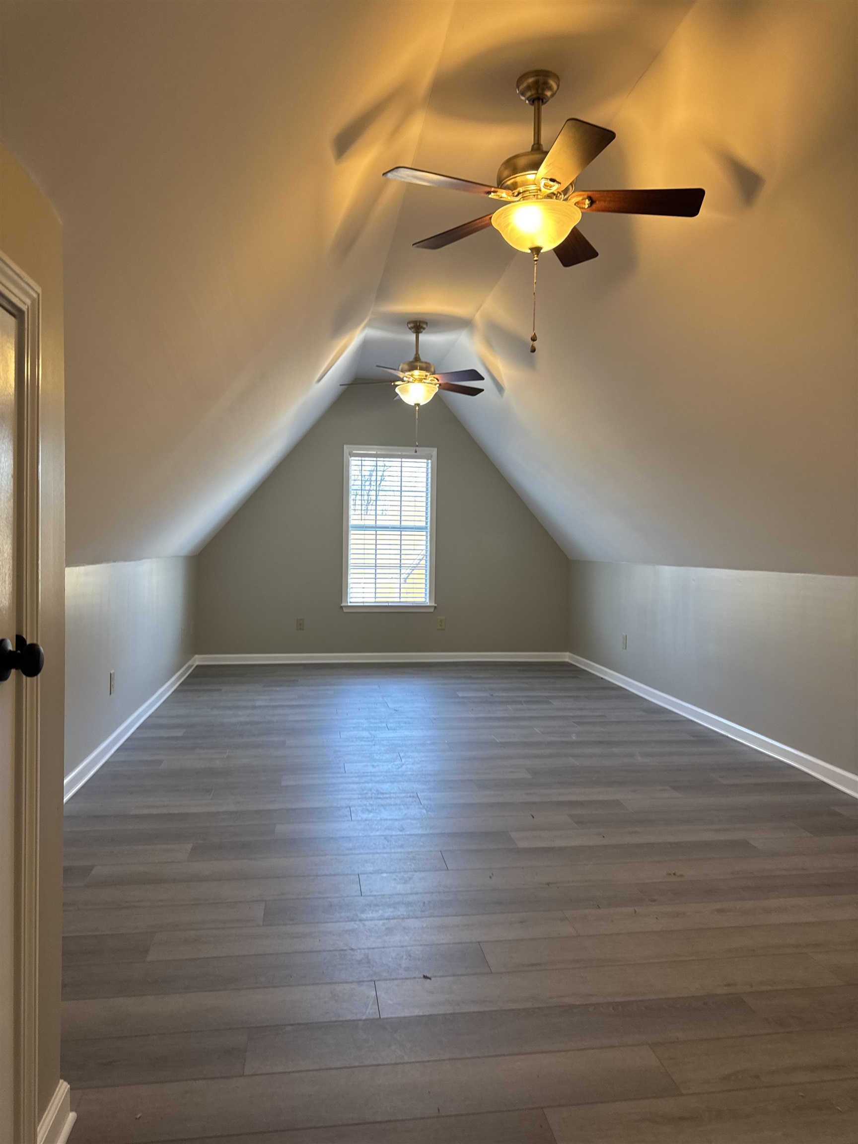 6333 Daybreak Drive Bartlett, TN 38135 - Photo 19 of 21 a view of an empty room with window and wooden floor