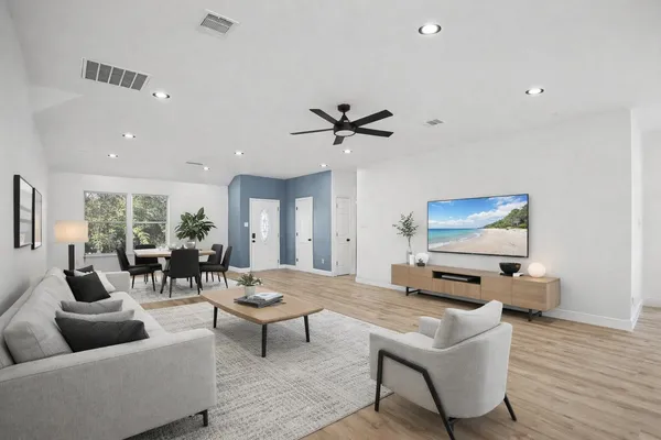 a living room with furniture and a flat screen tv