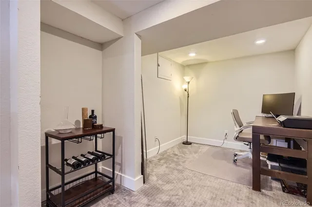 a view of a workspace with furniture