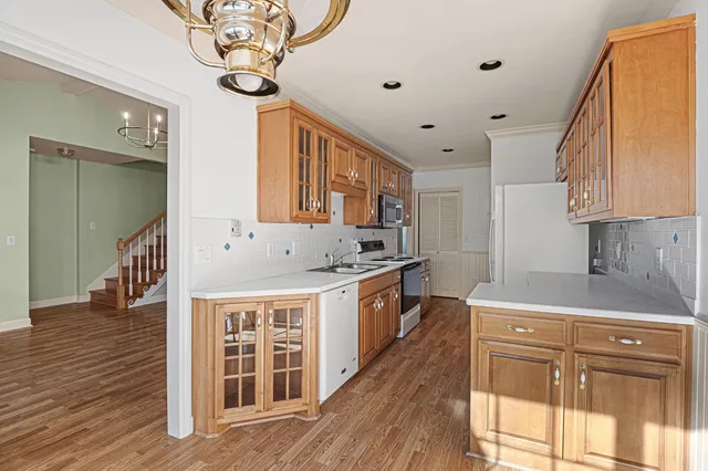 a kitchen that has a cabinets and a stove
