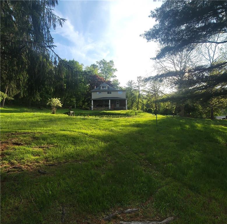 a view of a house with a big yard