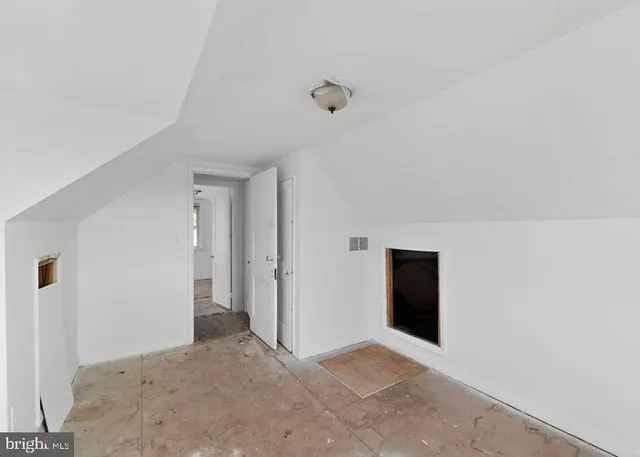 a view of empty room with windows