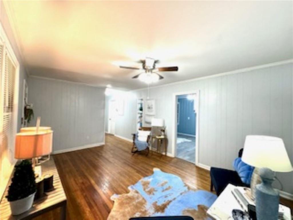 209 Moultrie Lane Southwest Rome, GA 30161 - Photo 21 of 46 a living room with furniture and a wooden floor