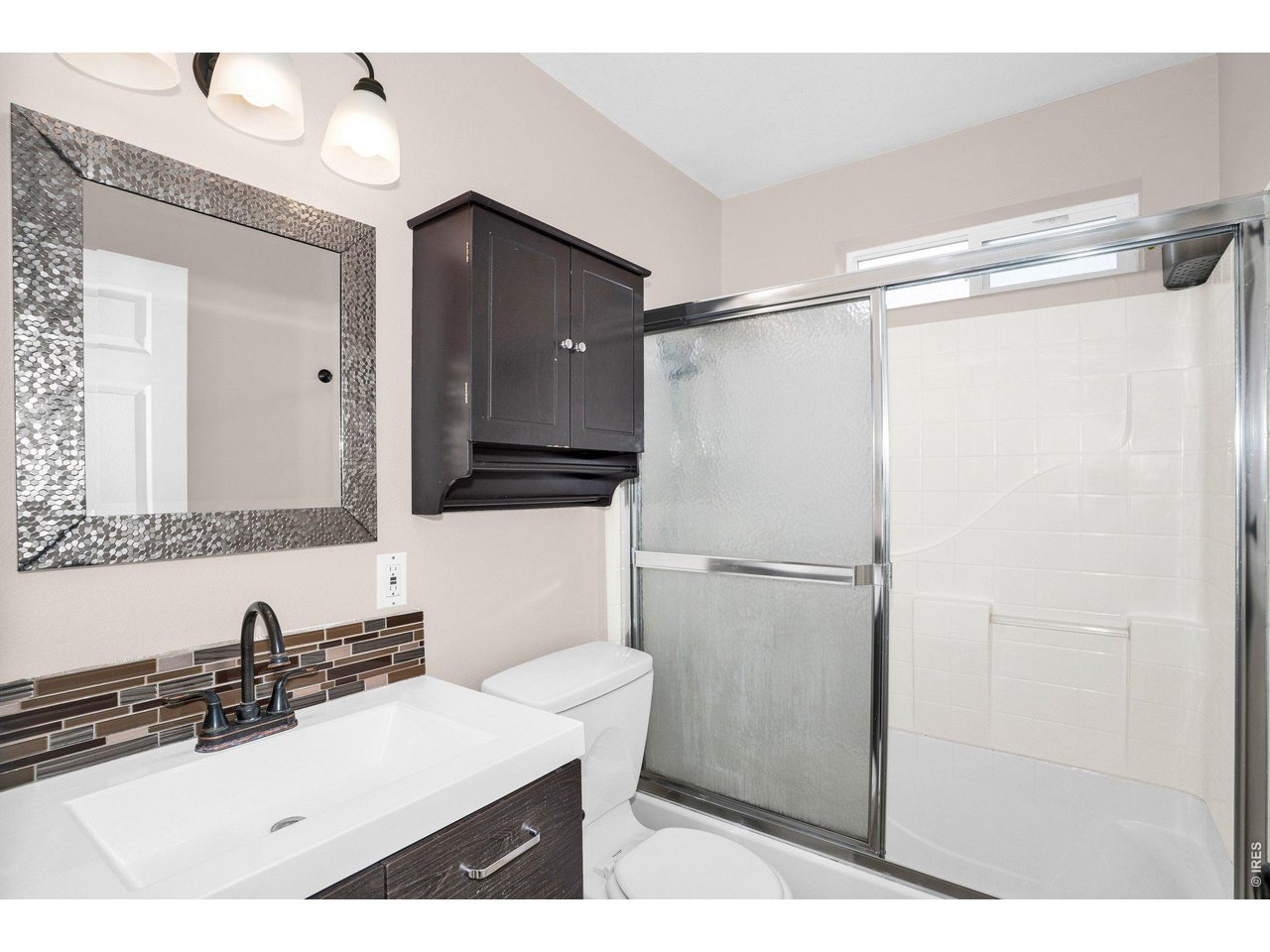 2616 23rd Avenue Greeley, CO 80634 - Photo 11 of 21 a bathroom with a sink vanity granite and a mirror