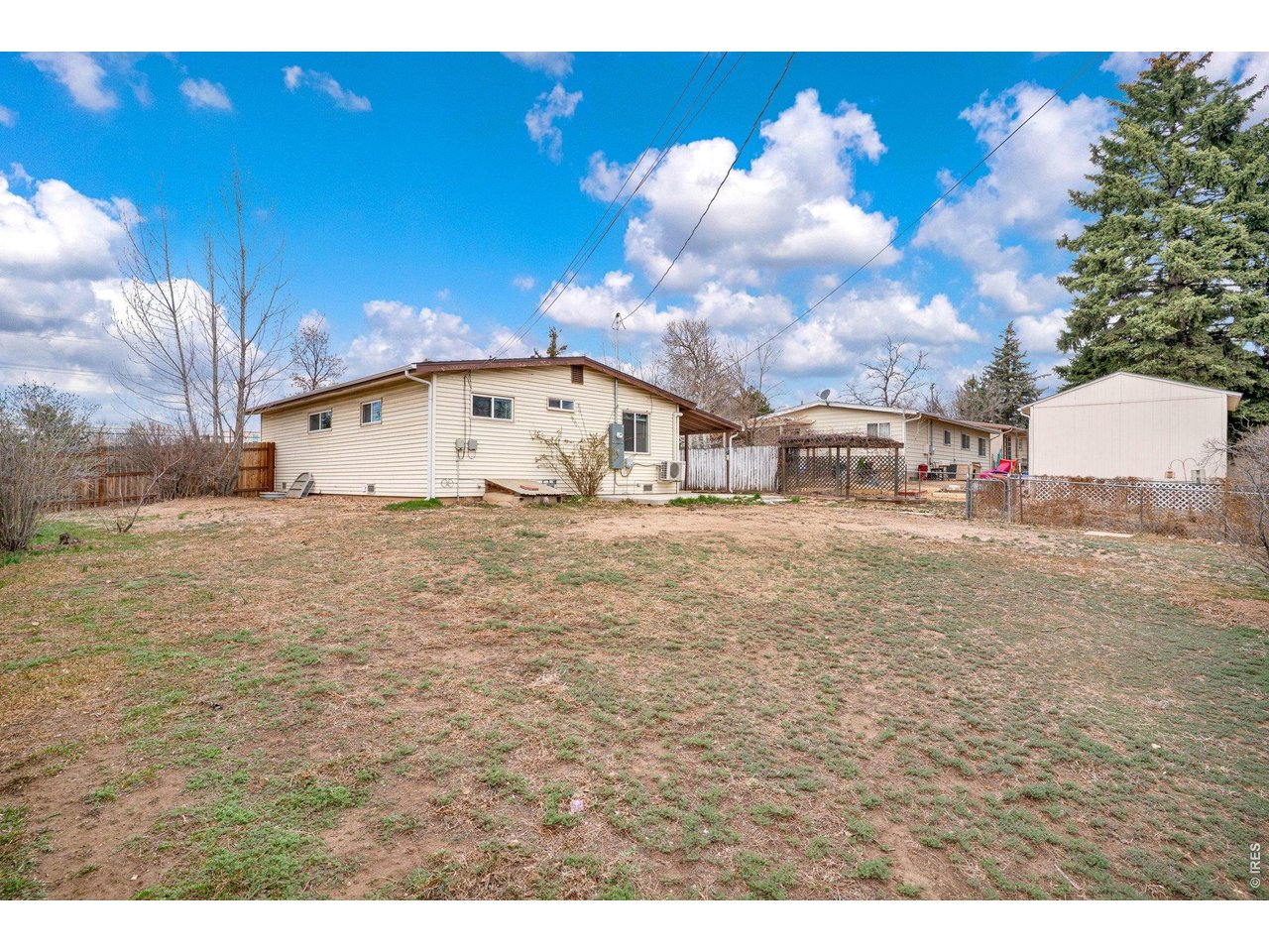 2616 23rd Avenue Greeley, CO 80634 - Photo 17 of 21 a view of a white house with a yard