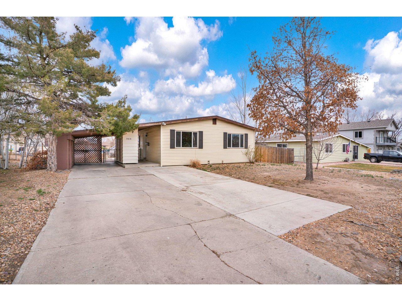 2616 23rd Avenue Greeley, CO 80634 - Photo 2 of 21 a view of house with outdoor space and sitting area