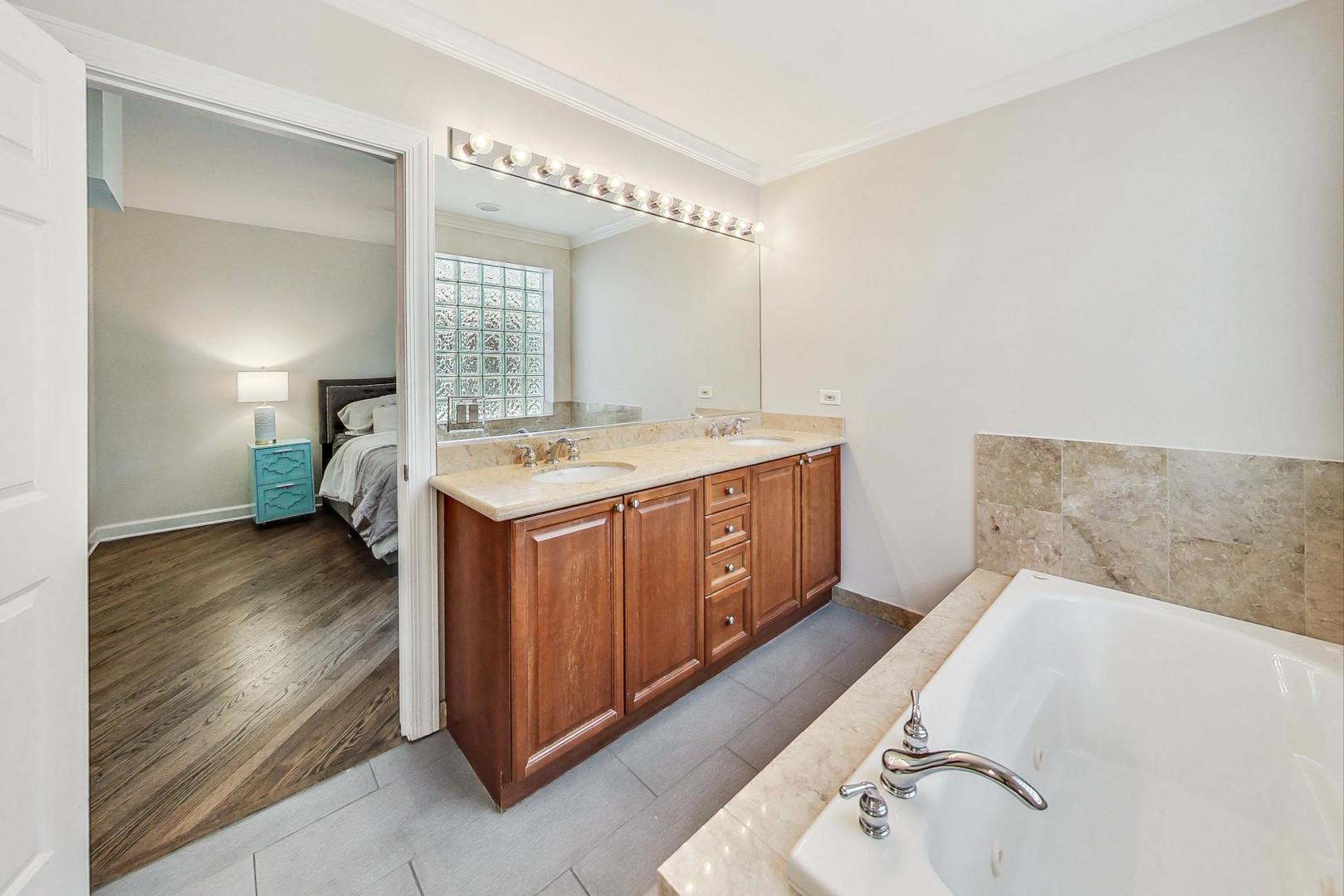 951 West Fletcher Street, Unit 2 Chicago, IL 60657 - Photo 15 of 26 a utility room with a sink washer and dryer