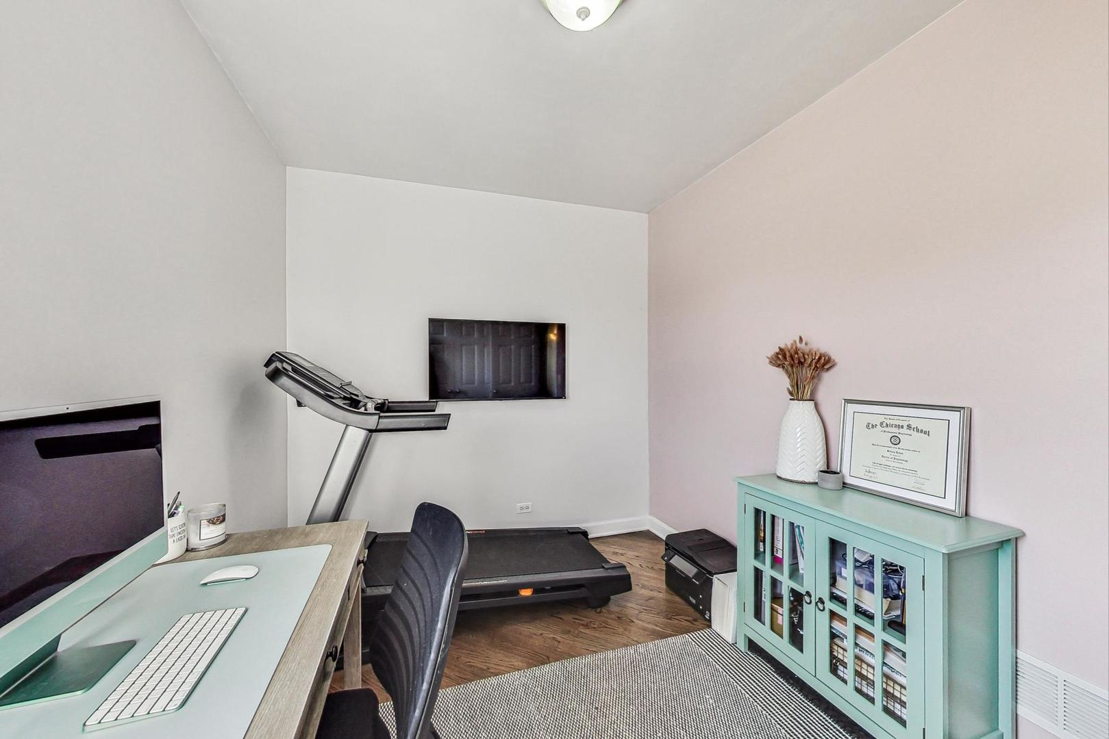 951 West Fletcher Street, Unit 2 Chicago, IL 60657 - Photo 19 of 26 a living room with furniture and a flat screen tv