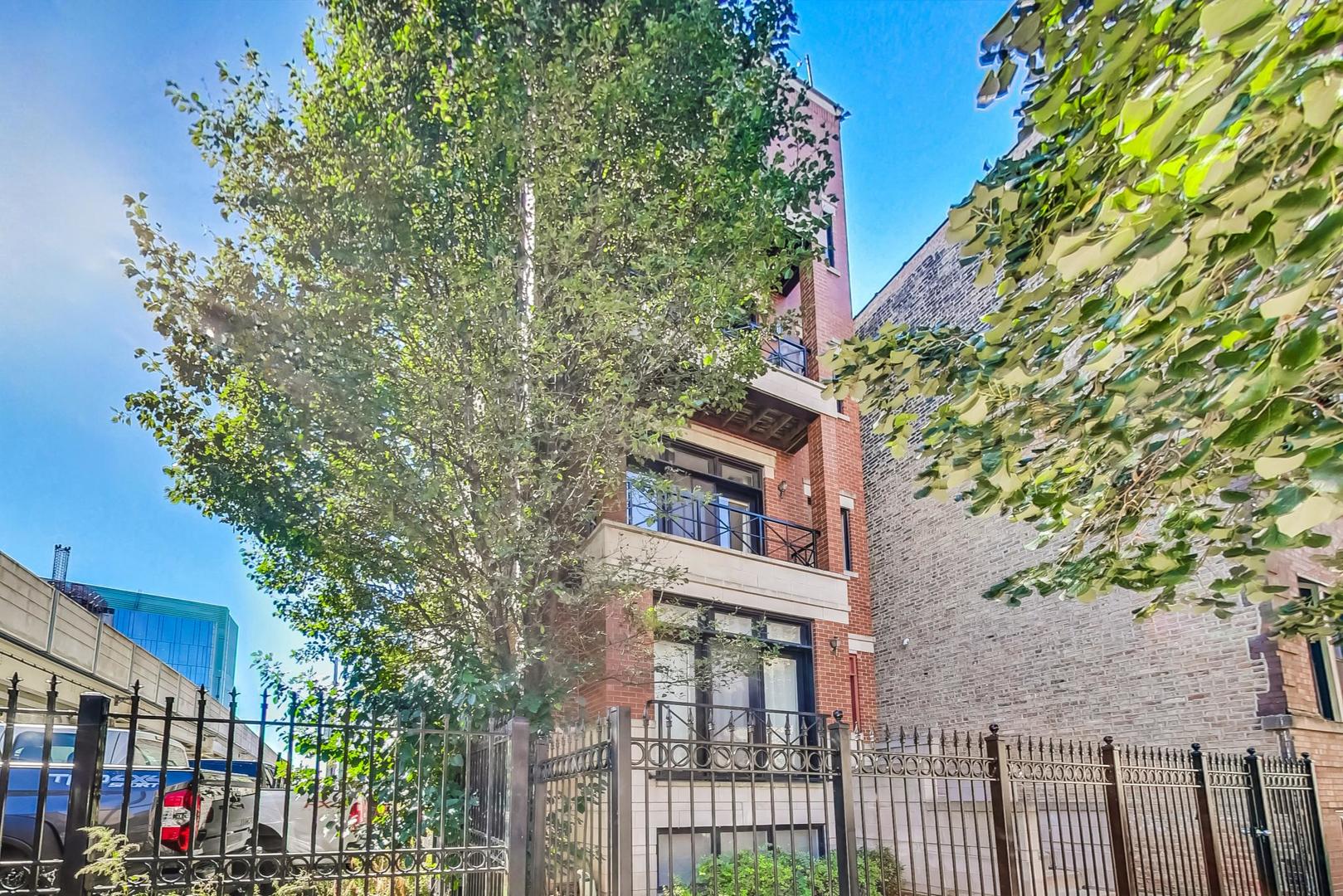 951 West Fletcher Street, Unit 2 Chicago, IL 60657 - Photo 2 of 26 a view of a house with a tree