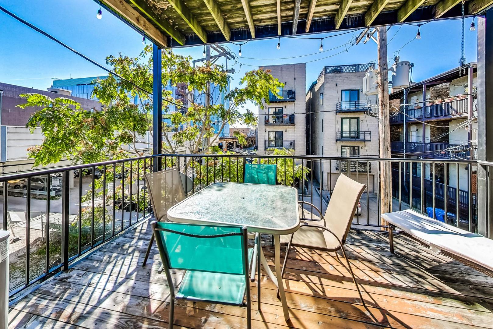 951 West Fletcher Street, Unit 2 Chicago, IL 60657 - Photo 23 of 26 a view of a chairs and table in the balcony