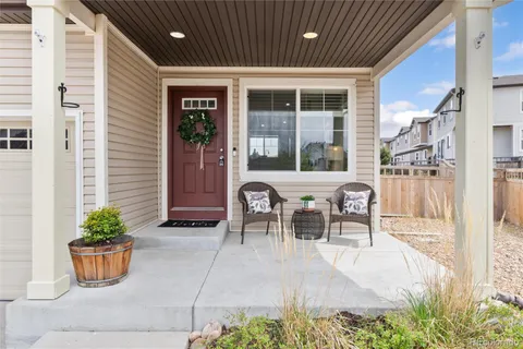 a outdoor space with a table and chairs