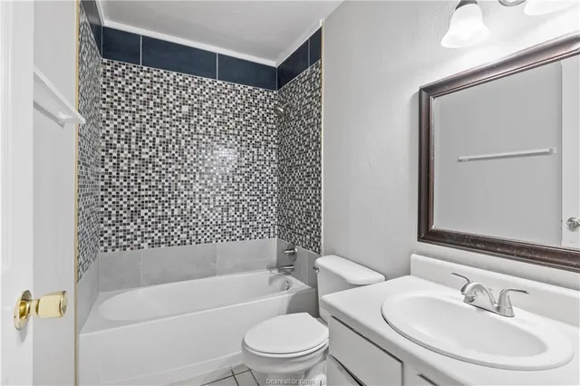 a bathroom with a bathtub and a sink