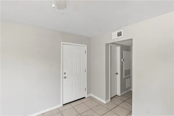a view of a livingroom and an empty room