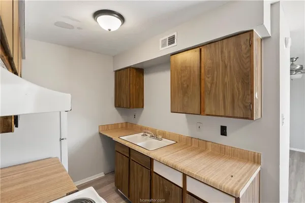 a kitchen with a stove and a microwave