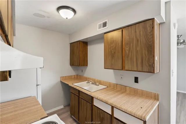 a kitchen with a stove and a microwave