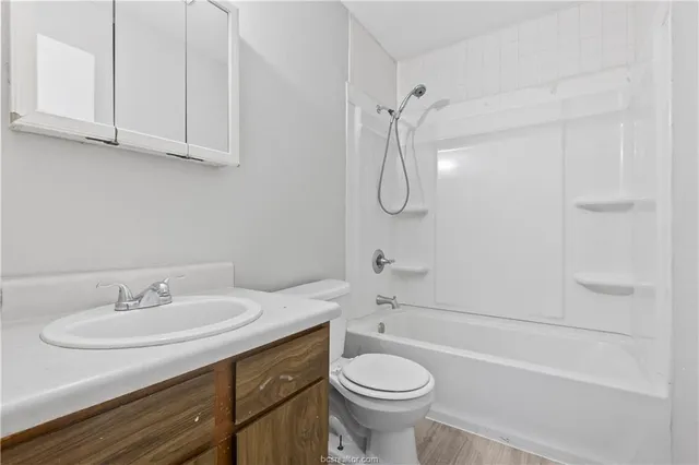 an empty room with a window and ceiling fan