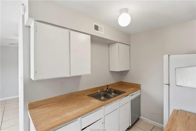 a kitchen with a stove and a refrigerator