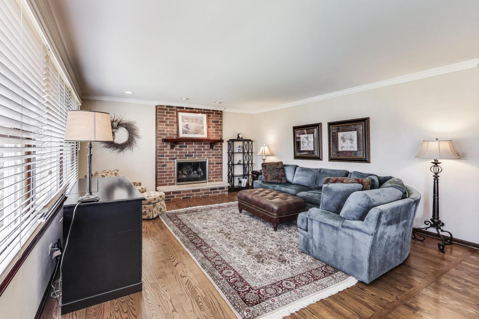 2207 North Brighton Place Arlington Heights, IL 60004 - Photo 12 of 37 a living room with fireplace furniture and a rug